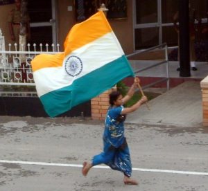 Indian woman runs with flag